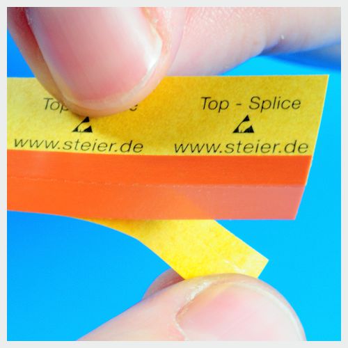 Grafik Top Splice ESD-gerechter Gurtverbinder zum Verbinden der Deckfolie eines Bauteilegurtes